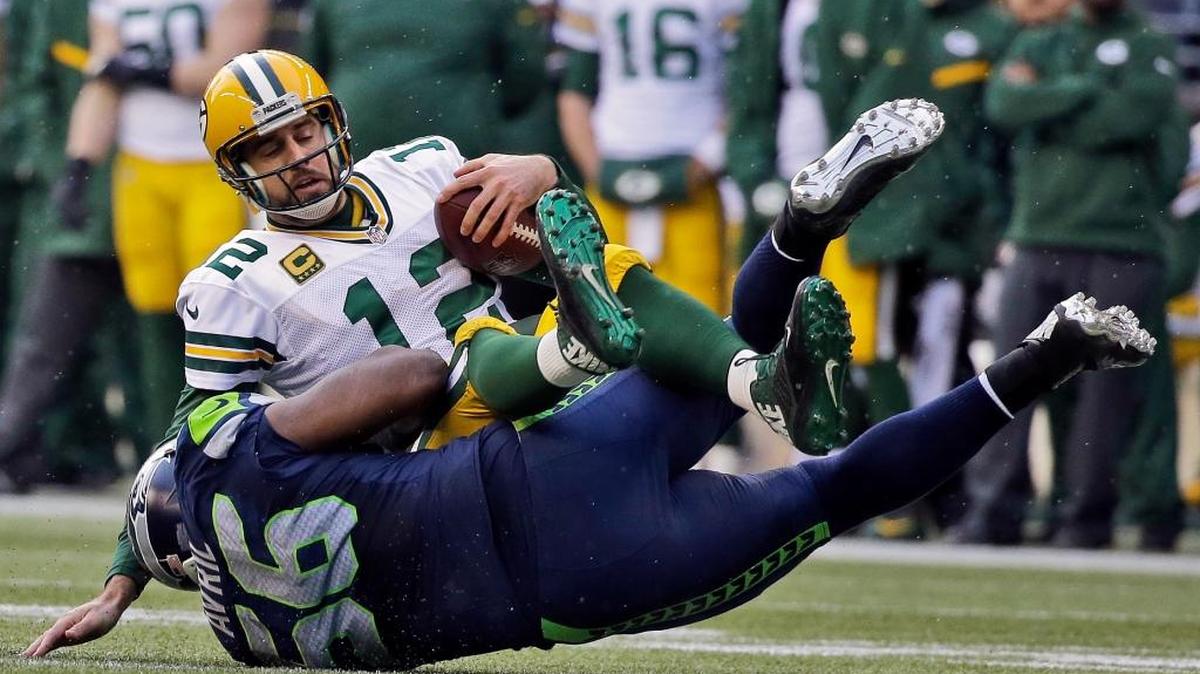 
Seahawks defensive end Cliff Avril sacks Packers quarterback Aaron Rodgers last January during the NFC Championship Game in Seattle. Rodgers has not played particularly well in three recent meetings against Seattle.
