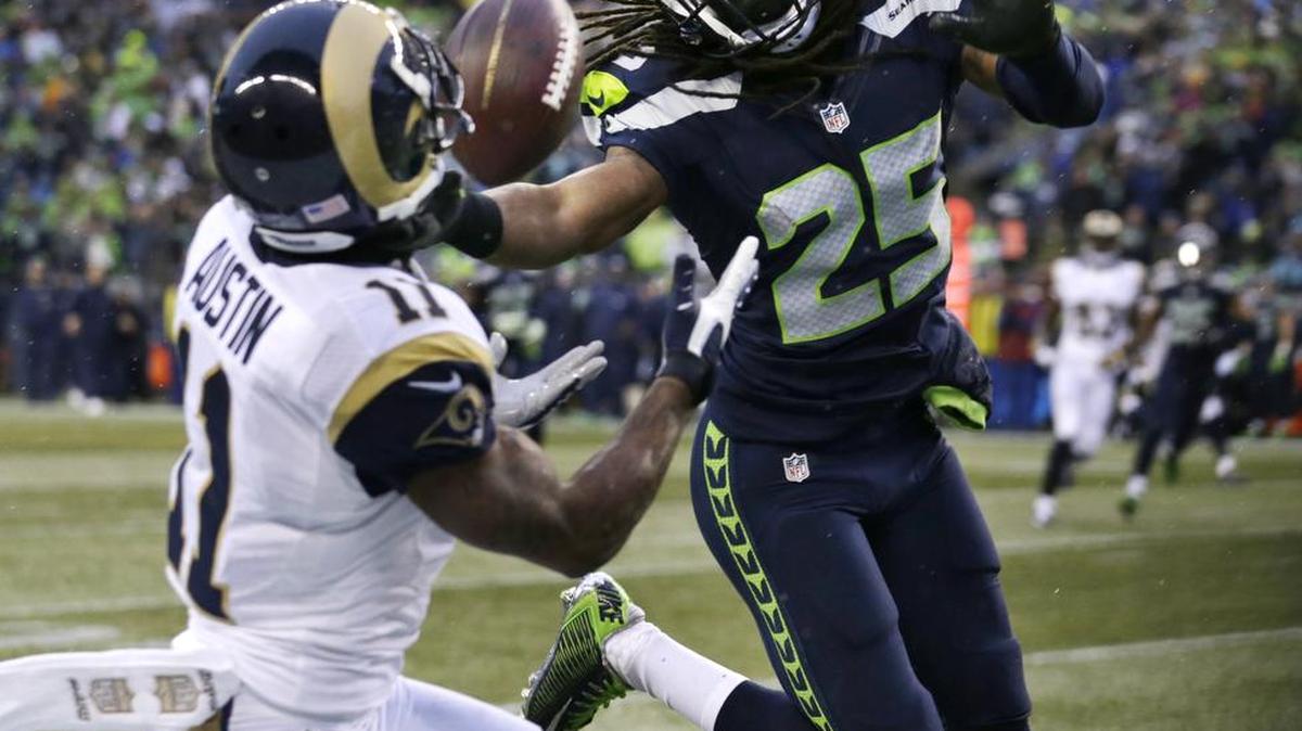 St. Louis’Tavon Austin (11) catches a pass in front of Seattle’s Richard Sherman on Sunday, Dec. 27, in Seattle.
