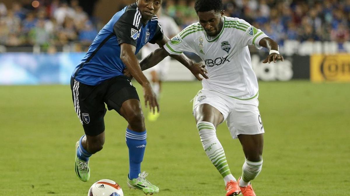 
San Jose Earthquakes midfielder Cordell Cato, left, and Seattle Sounders forward Obafemi Martins chase the ball during the first half Saturday in San Jose.
