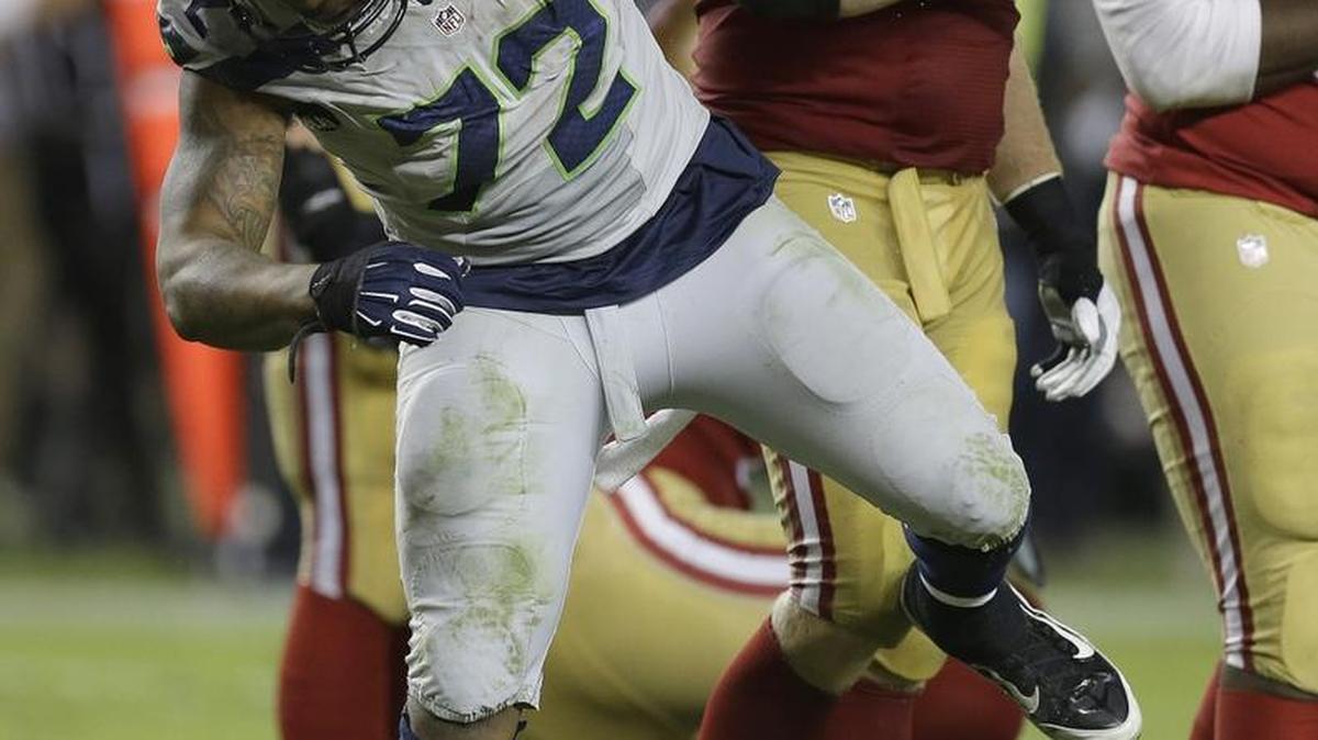 Seattle Seahawks defensive end Michael Bennett reacts after sacking San Francisco 49ers quarterback Colin Kaepernick on Oct. 22.