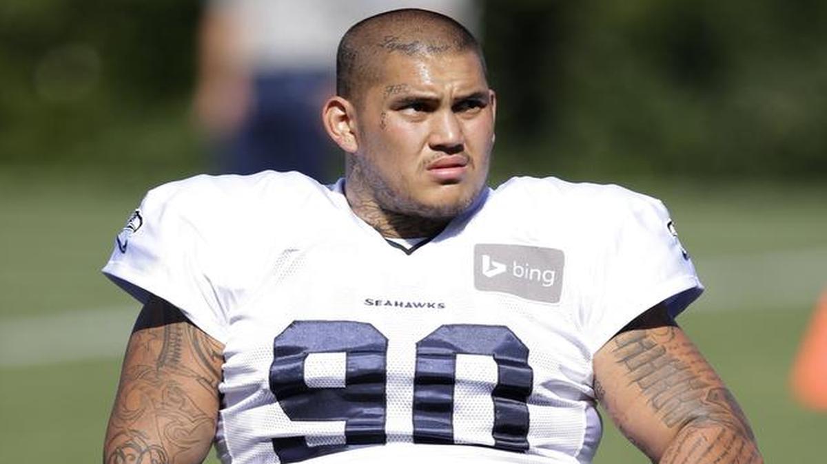 
Seattle Seahawks defensive tackle Jesse Williams stretches during practice in 2014. Williams missed his first two seasons due to injury. 
