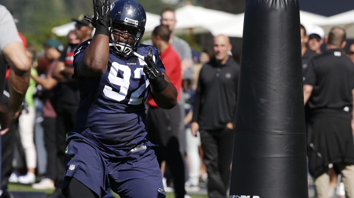 
Seattle Seahawks' Brandon Mebane runs through a drill at an NFL football training camp Wednesday, Aug. 19, 2015, in Renton.

