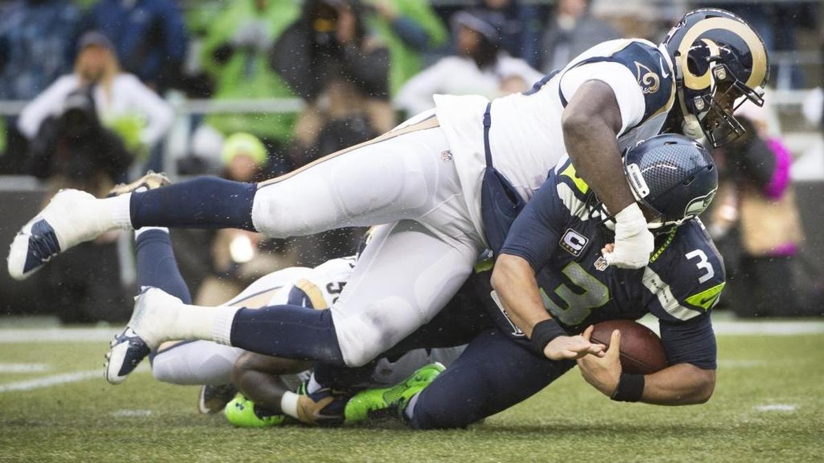 Rams defensive lineman William Hayes sacks Seahawks quarterback Russell Wilson during Sunday's NFL football game against the St. Louis Rams at CenturyLink Field in Seattle on Dec. 27, 2015.