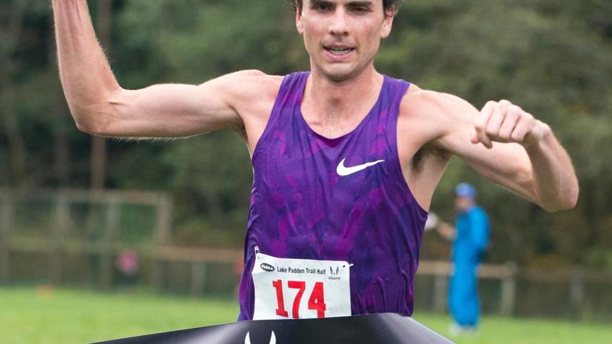 
Patrick Smyth crosses the finish line in first place at the Lake Padden Trail Half Marathon on Saturday, Oct. 17, in Bellingham. The race served as the USATF National Trail Championships.
