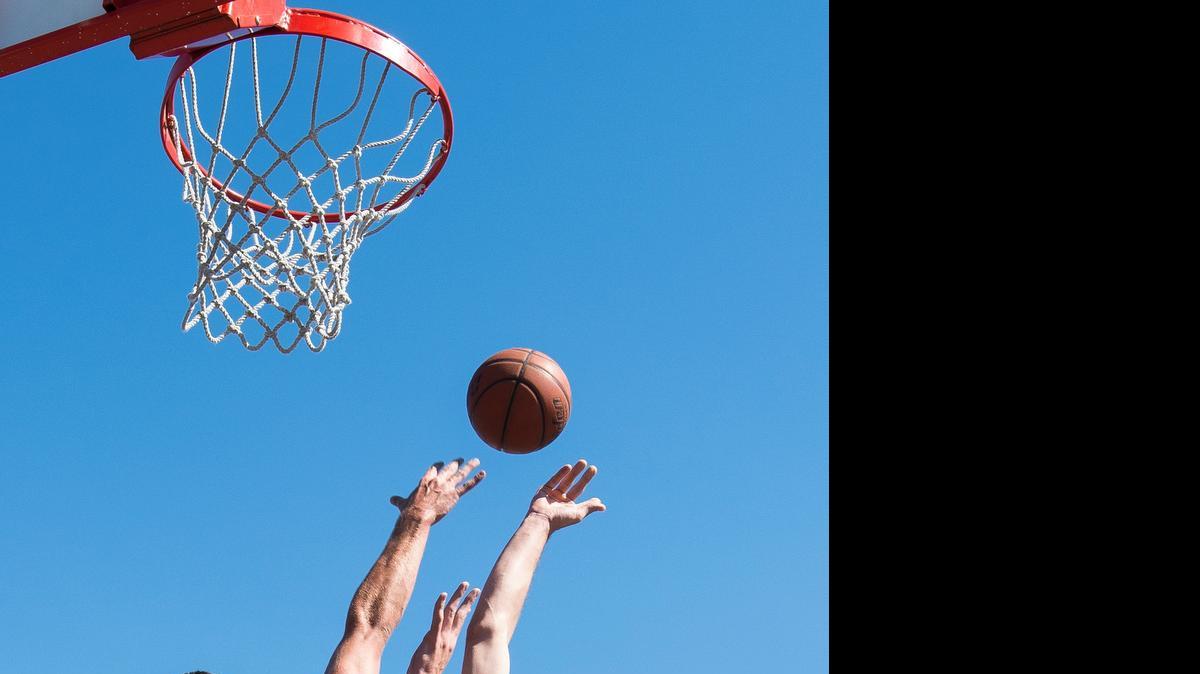 
Austin Bragg, center, puts in a layup during a semifinal game of the men's competitive bracket at the Curt Maberry Memorial Classic 3-on-3 Basketball Tournament on Saturday, July 18, in Lynden.
