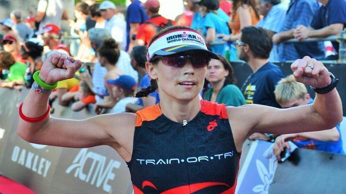Michele Blumenshine crosses the finishline with a final time of 5 hours, 41 minutes and 35 seconds at the 2015 Ironman 70.3 World Championship on Aug. 30, in Austria.