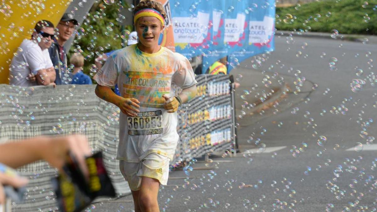 
Gus Diehl, 15, is the third to cross the finish line at the inaugural Bellingham Color Run on Sunday, August 16.
