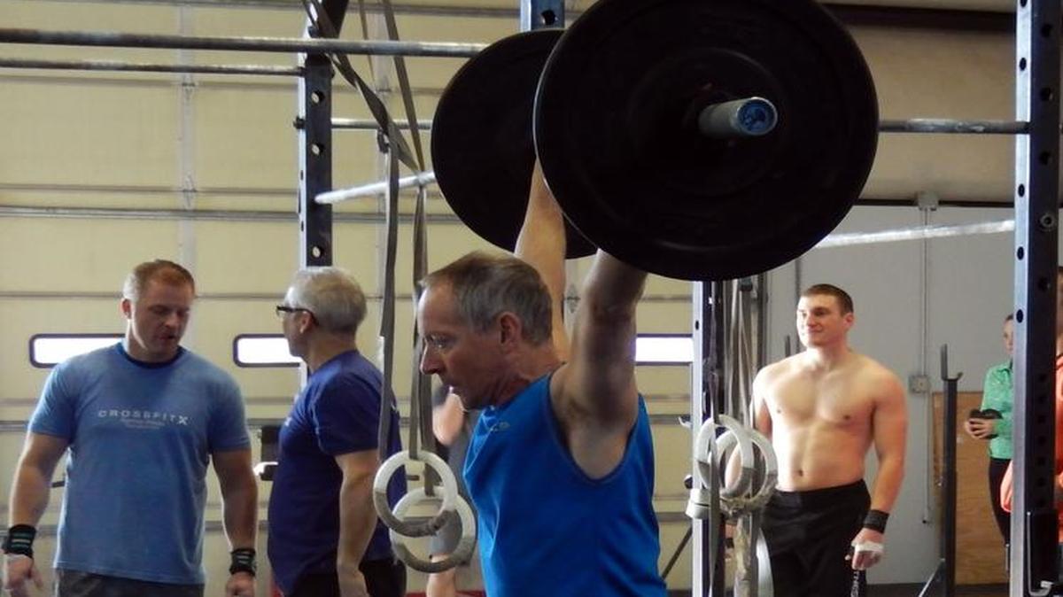 
Bellingham resident Paul Clinton, 60, performs overhead squats during the Open Competition portion of qualifiers for the 2015 Reebok CrossFit Games. Clinton is one of 20 qualifiers out of 1,100 who qualified for the CrossFit Games held Tuesday-Sunday, Jul 21-26, in Carson, Calif.
