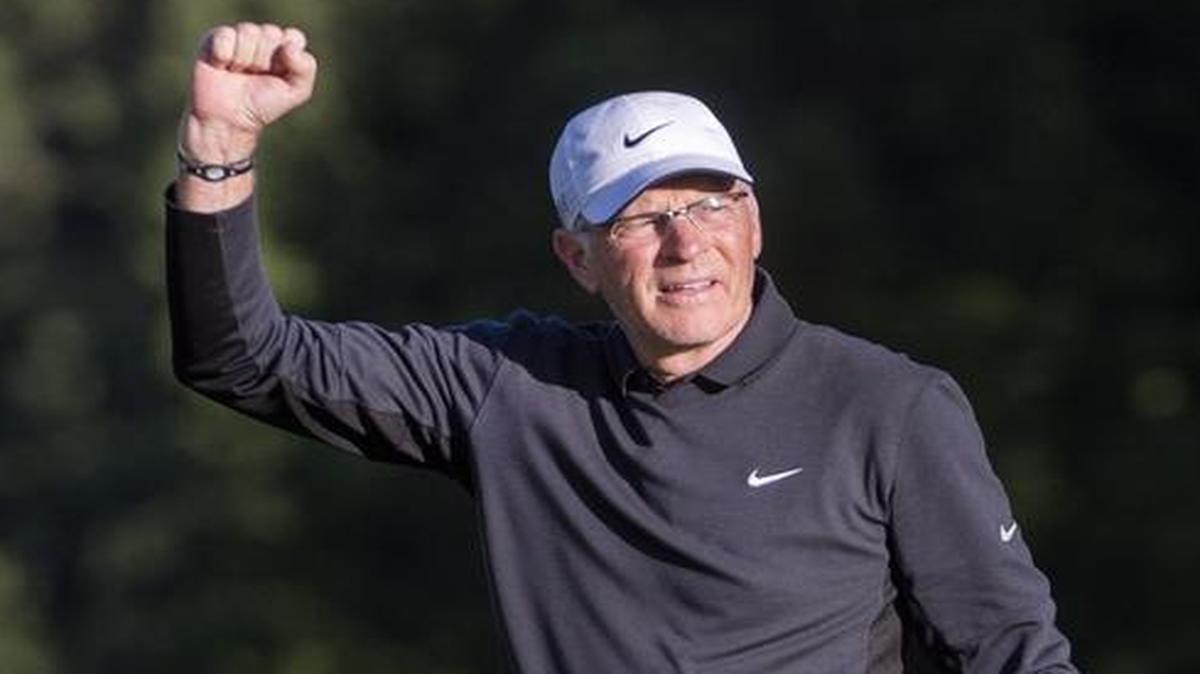 Jeff Coston pumps his fist after making a key chip onto the 18th green, leaving him a short birdie putt at the Washington Open Invitational at Meridian Valley Country Club in Kent on Wednesday.