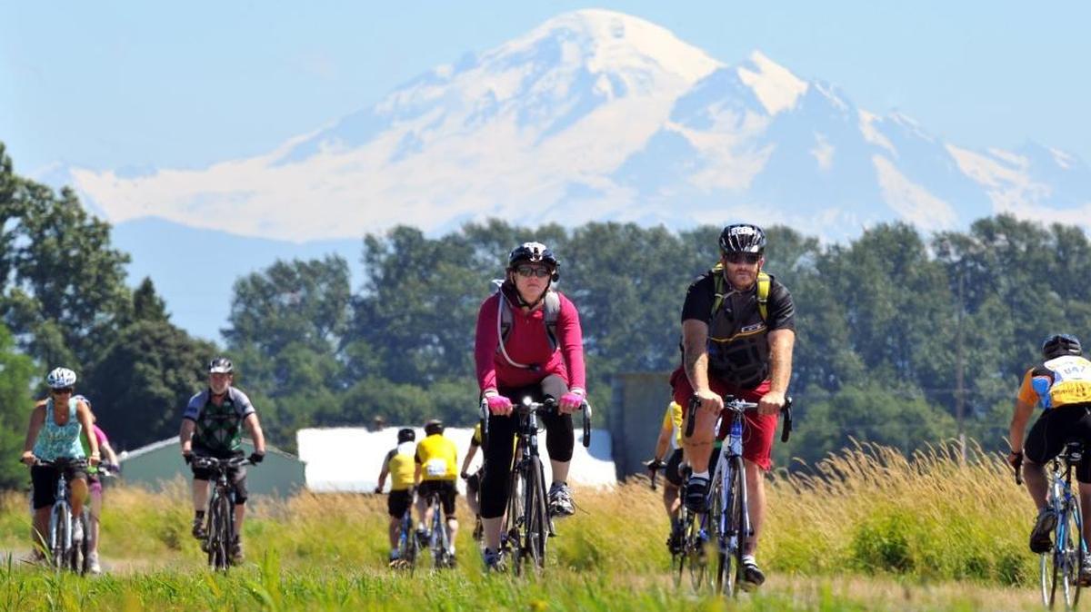 With Mt. Baker in the background, riders head to the first stop during the 2011 Tour de Whatcom. This year’s ride will be held Saturday, July 23.