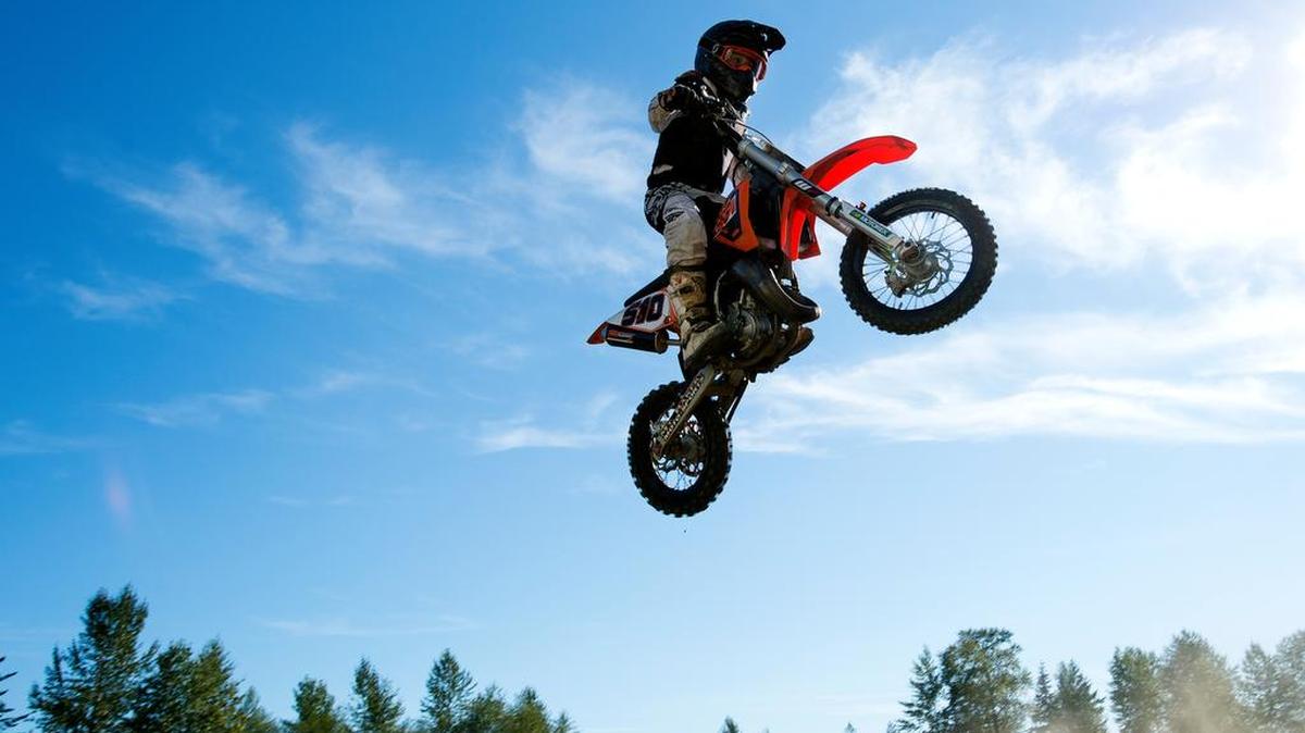
Kyle Skillman goes over a jump during a Thursday Night Motocross 65cc race Thursday, Aug. 6, at Hannegan Speedway in Bellingham.
