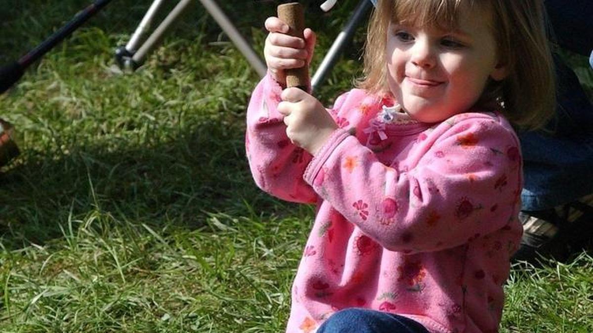 Bellingham’s Grace Murphy, then 2, tries her best to reel in a fish at the Bellingham Kids Fishing Derby at the Whatcom Falls derby pond in 2003.