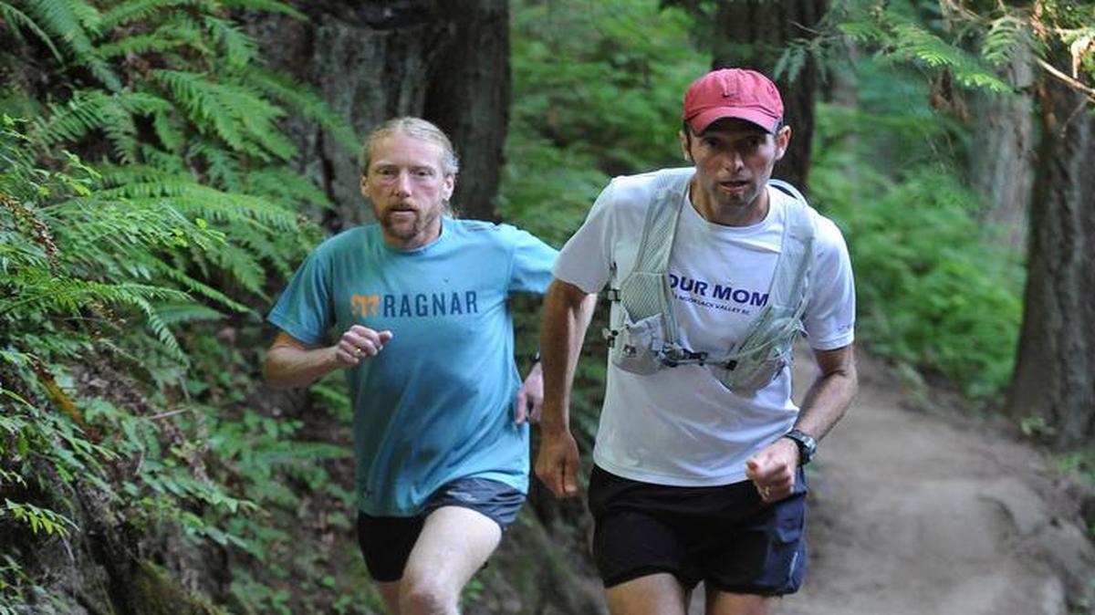 
Cross country coaches Jay Sloane, left, of Mount Baker High School and Collin Buckley of Nooksack Valley High School train Wednesday, August 1, 2012, on Galbraith Mountain. Sloane and Buckley are part of the Wander Brewery team competing in the Ragnar Relay.

