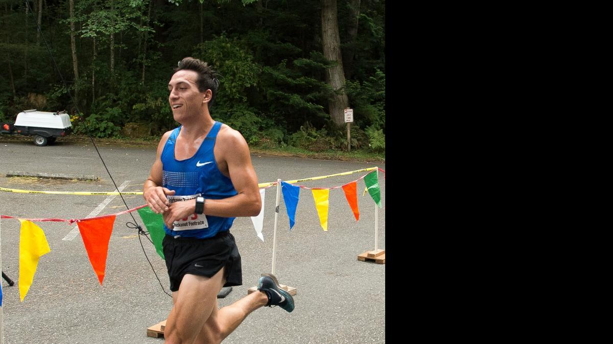 
Dillon Quintana crosses the finish line to take first place at the Chuckanut Foot Race on Saturday, July 11, in Bellingham.
