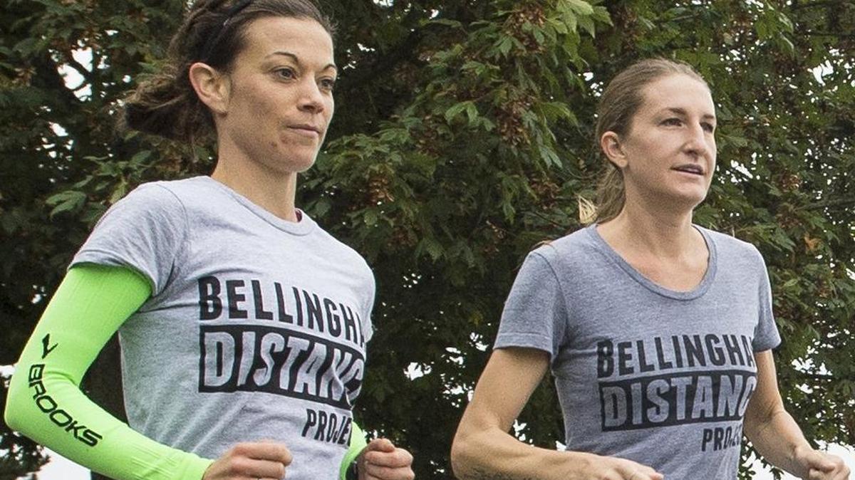Bellingham Distance Project running club members Amber Morrison, left, and Courtney Olsen run at Boulevard Park in preparation for the 2014 Chicago Marathon. Morrison won the 2016 Seattle Marathon women’s title Sunday, while Olsen was the top finisher in the half marathon.