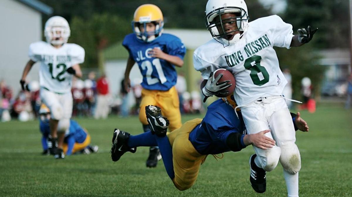 Tyrone Butler, of King Nissan Volvo, gets some yardage on a running play against JLGC during the Boys and Girls Club of Whatcom County youth football jamboree in 2009 atNorthwest Soccer Fields in Bellingham. The organization announced that the recently completed 2017 tackle football season will be its last.