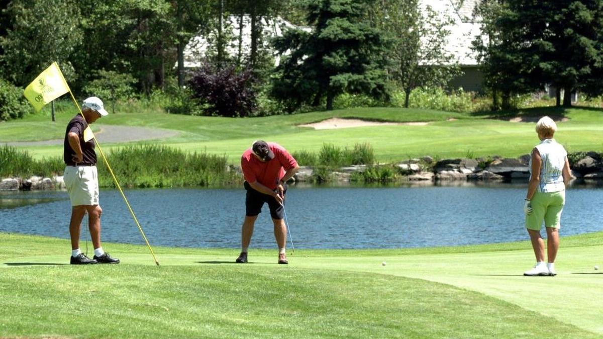 Adrian Porter, left, Richard Gray, and Shirley Porter finish the 11th hole at Semiahmoo Golf and Country Club in June 2006. The hole was selected on the Great Holes of the Northwest by Pacfic Northwest Golfer magazine.