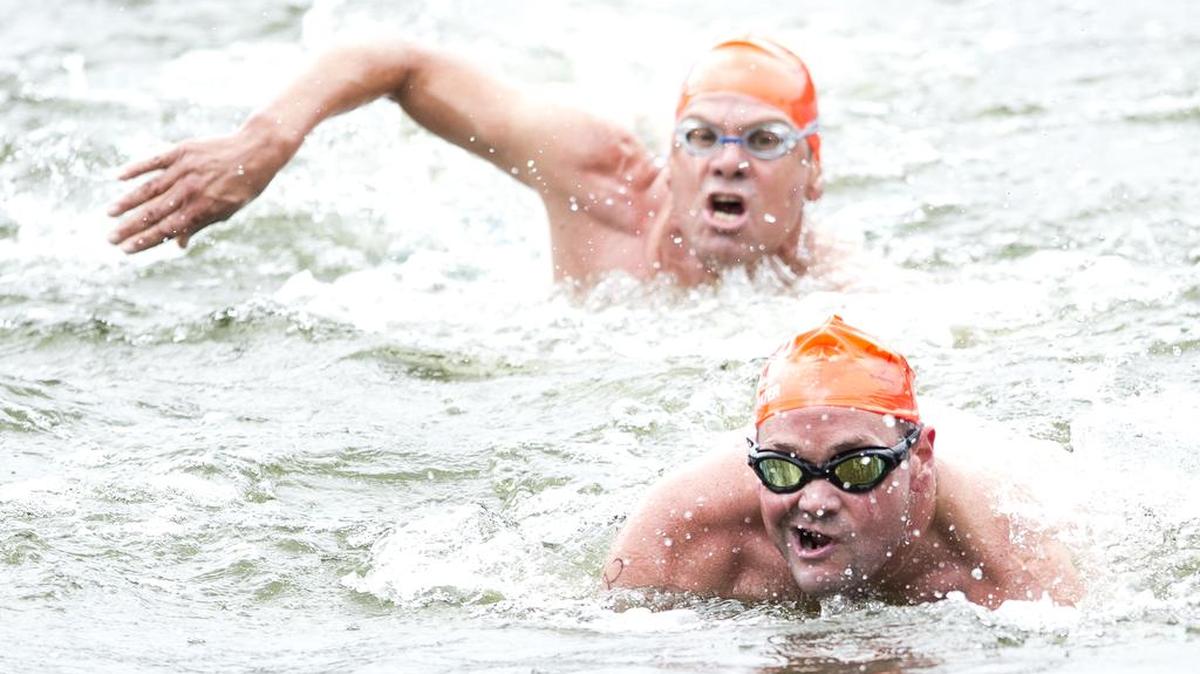 
Brock Jones, bottom, and Rod Craig swim toward the finish line of the Aly Fell Open Water Swim on Saturday, Aug. 15, at Lake Padden in Bellingham, Wash. Jones took first place in the 5k division with Craig finishing a close second.
