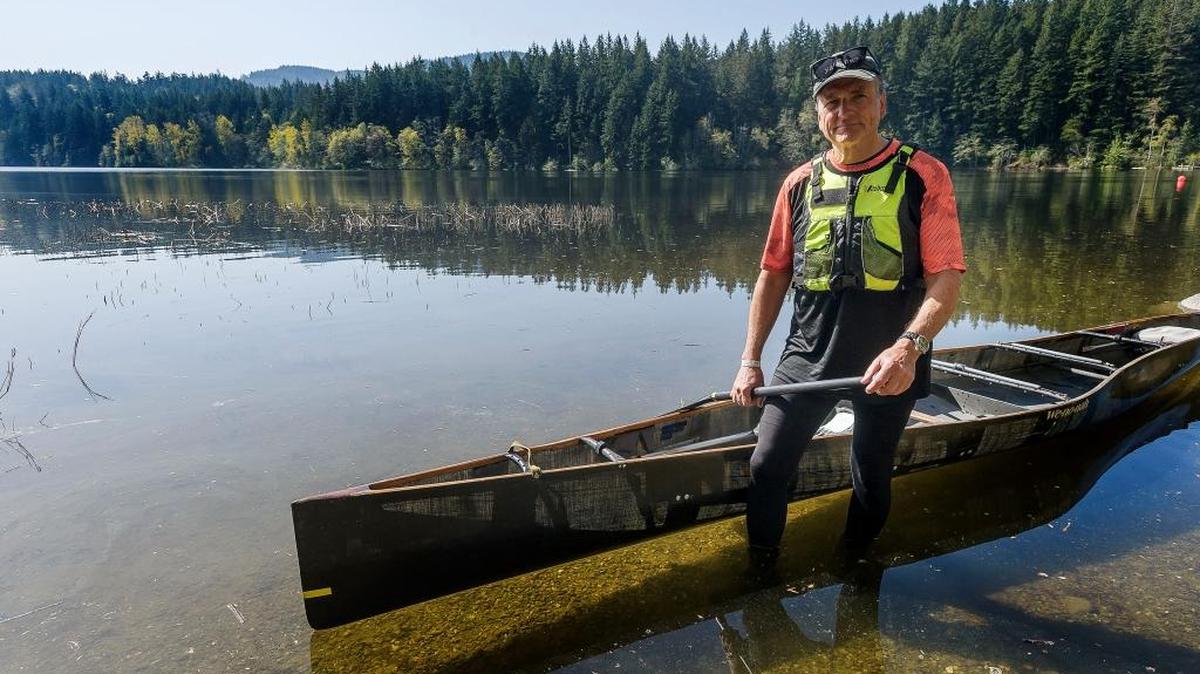 Ski to Sea competitor David Scherrer prepares to enter his canoe at Lake Padden April 25. Scherrer says he may have the longest streak competing in the annual Ski to Sea adventure race which is run each year the Sunday before Memorial Day.