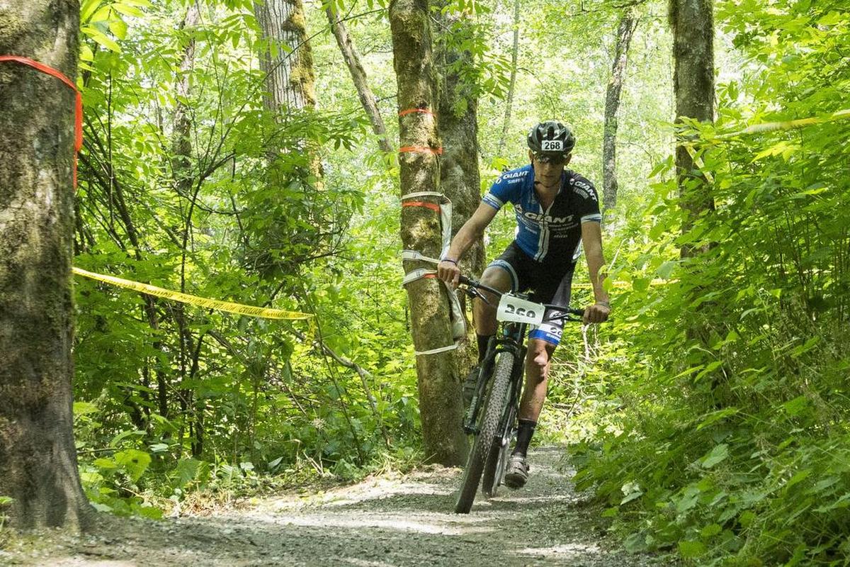 Nolan Brady of “Aeromech/Sensible.Technology” competes in the mountain bike leg of the 2015 Ski to Sea Race.