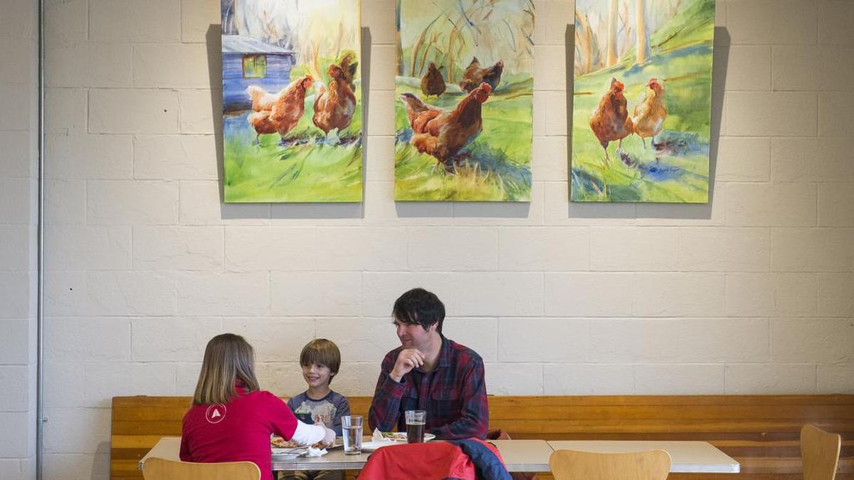 From left to right, Justine Waymire, Liam Waymire and Jody Waymire eat pizza at Greene's Corner in Bellingham.