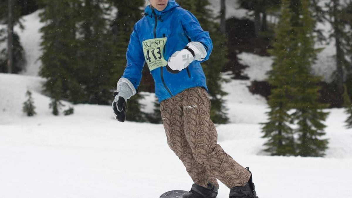 Cheri Austin of There Better Be Beer at the Bottom! snowboards during the 2013 Ski to Sea. Snowboarding was added as an option to the leg in 2004.