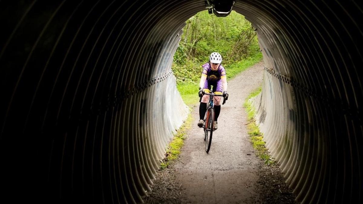 Kirsten Jensen, member of the Jack’s Bicycle Center Competitive Women’s Ski to Sea team, is pictured on her bike on Thursday, April 27, at the tunnel under Barkley Boulevard in Bellingham. Jensen and the team want to empower Whatcom County women with another strong performance in the race.