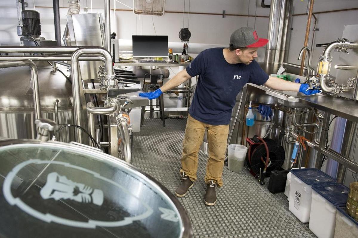 Frank Trosset, head brewer, brews Batch 15 IPA at Aslan Brewing Co. on in March 2017 in Bellingham.