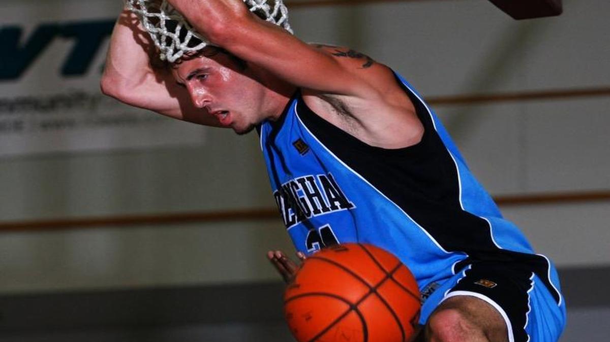 Slam forward Tyler Amaya dunks over Express guard Coleco Buie during a game in 2008. Amaya, now a player-coach for Bellingham, and his team will face a team of Western Washington alumni on May 15.
