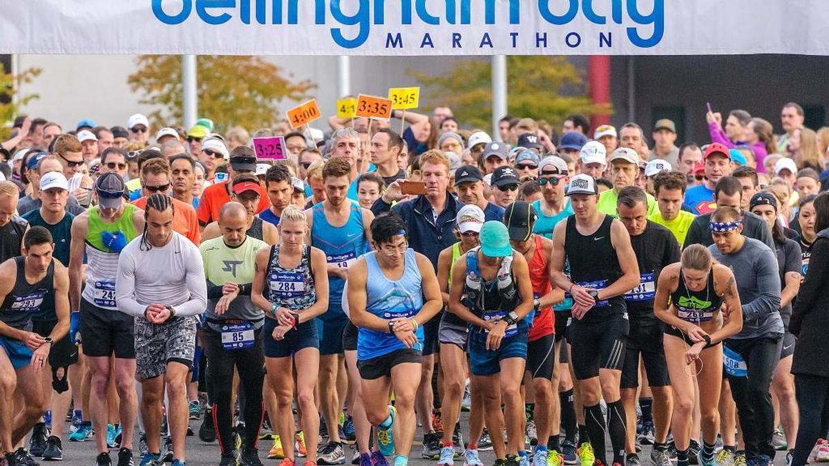 Competitors start their timers during the start of the 2017 Bellingham Bay Marathon starting at Lummi Nation School and finishing at Market Depot Square on Sunday Sept. 24, 2017.