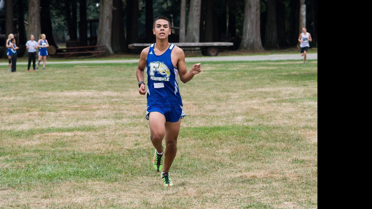 
Ferndale’s Roberto Aguilera sprints to the finish line during a cross country meet against Squalicum and Lynden at Berthusen Memorial Park on Wendesday, Sept. 17, 2014 in Lynden.

