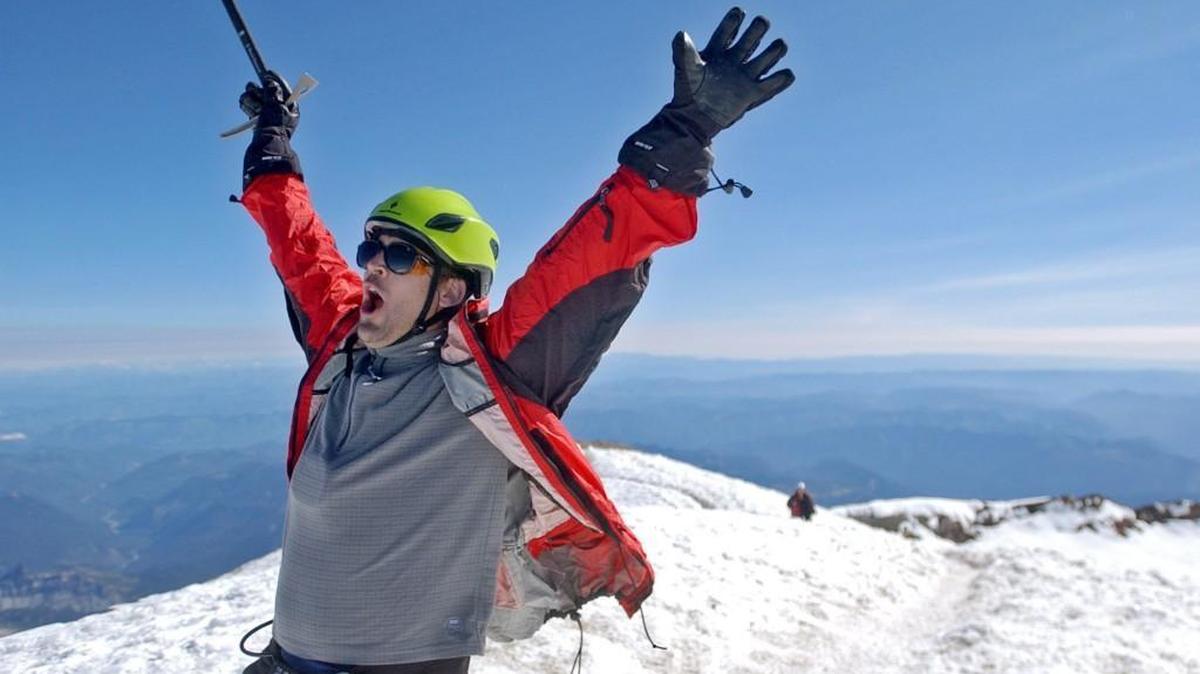 John Osmundson of Colorado (formerly of Puyallup) celebrates reaching the summit of Mount Rainier.