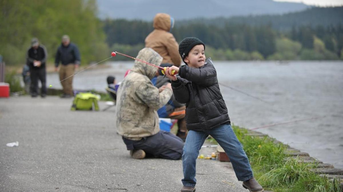 Ty Sanchez, then 5, of Lynden, reaches back to cast on opening day of the fishing season on Lake Padden in April 2013.