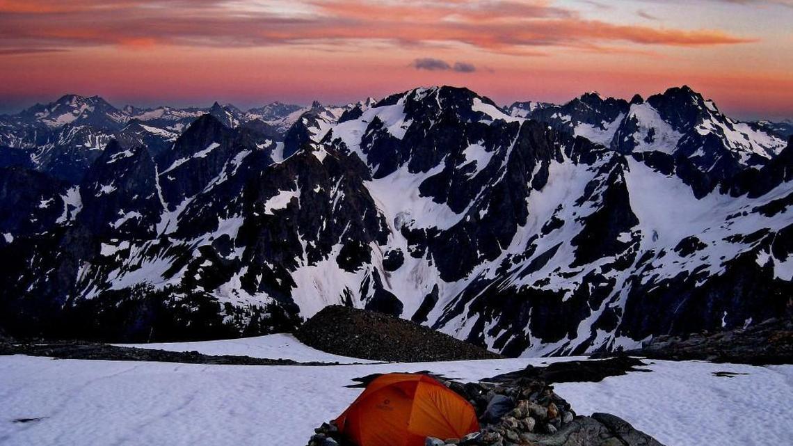 An array of peaks and glaciers remind climbers of the Alps looking south from Sahale Glacier Camp in North Cascades National Park.