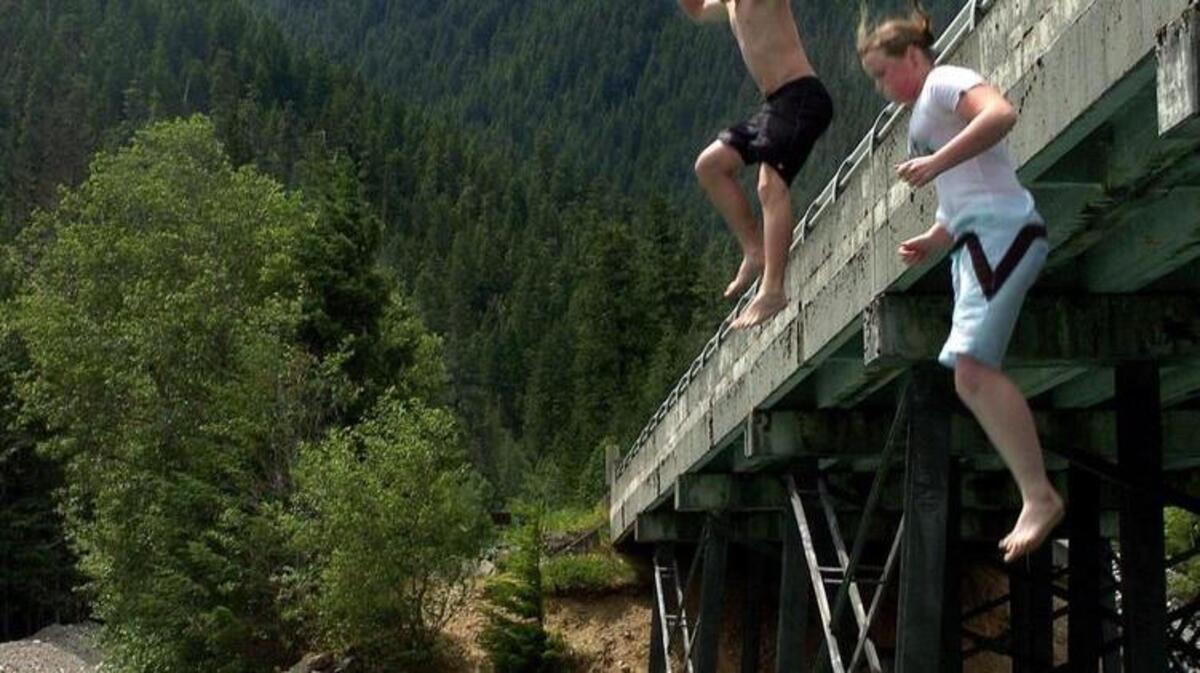 Nick Corson and his cousin Kaity Elliott, both from California, brave the cool waters of Diablo Lake.
