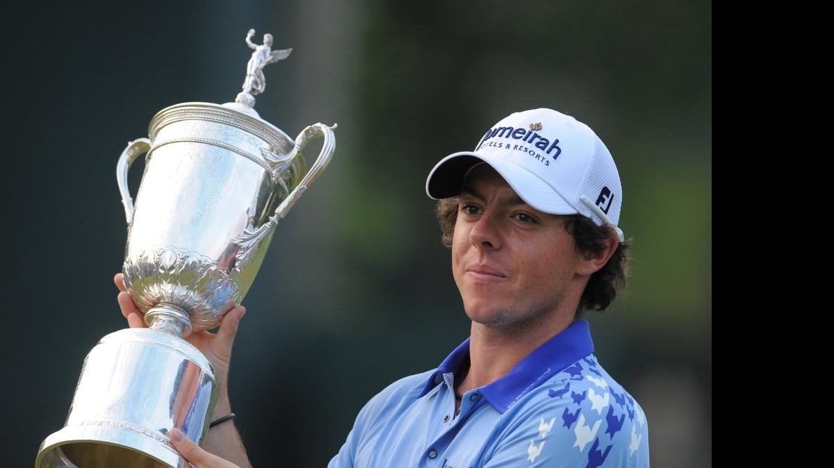 
Rory McIlroy holds up the U.S. Open championship trophy at Congressional Country Club in Bethesda, Md., Sunday, June 19, 2011.
