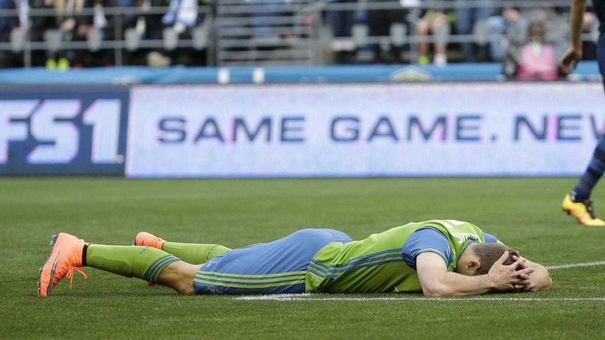 Seattle’s Jordan Morris lies on the pitch after missing a shot on goal against Sporting Kansas City on March 6. Seattle has had a problem with scoring goals so far in the early part of this season.