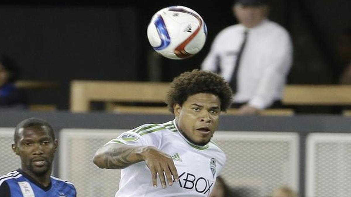 
Sounders defender Roman Torres, right, jumps for a ball Saturday against the Earthquakes in San Jose. Torres injured his knee during the game and will miss the rest of the season.
