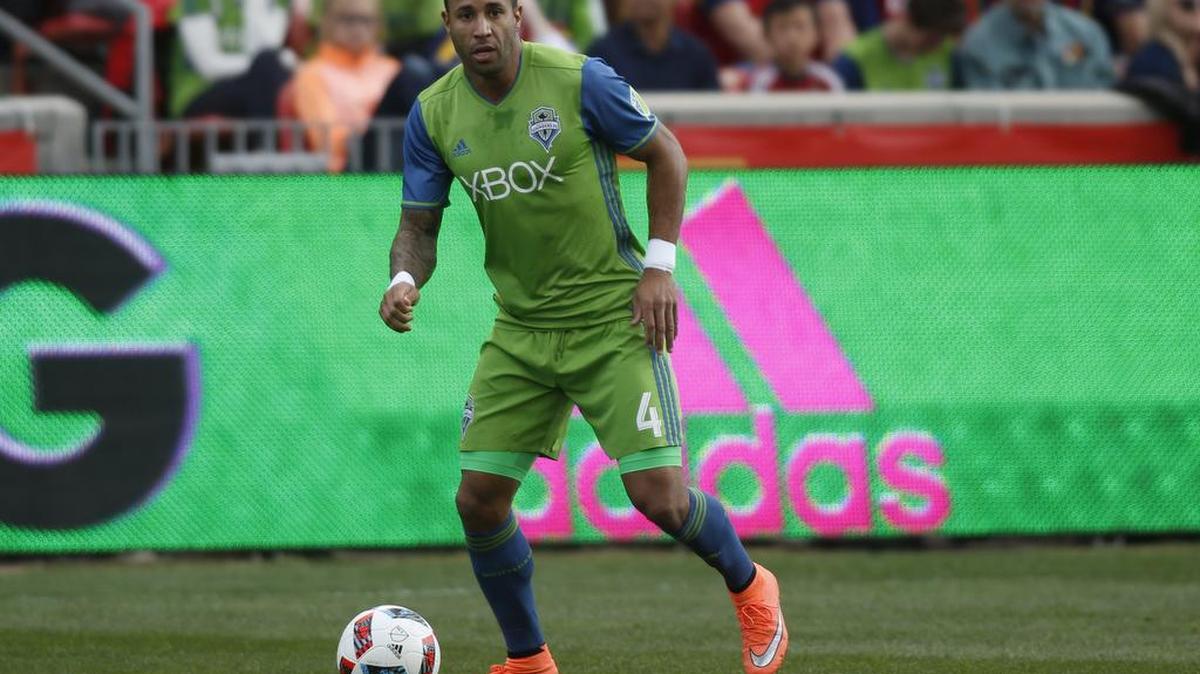 Seattle Sounders' Tyrone Mears (4) dribbles the ball during the first half of an MLS soccer game against Real Salt Lake on Saturday, March 12, 2016, in Sandy, Utah. (AP Photo/Kim Raff)