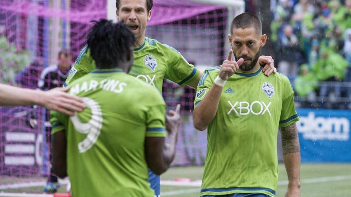 Seattle’s Clint Dempsey, right, acknowledges the assist from teammate Obafemi Martins (9) after scoring the first goal of the game. Dempsey finished the 3-1 victory with two goals and an assist.