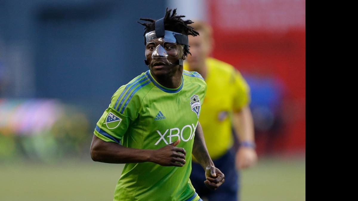 Seattle Sounders' Obafemi Martins wears a protective mask during an MLS soccer match against FC Dallas, Saturday, June 13, 2015, in Seattle. (AP Photo/Ted S. Warren)