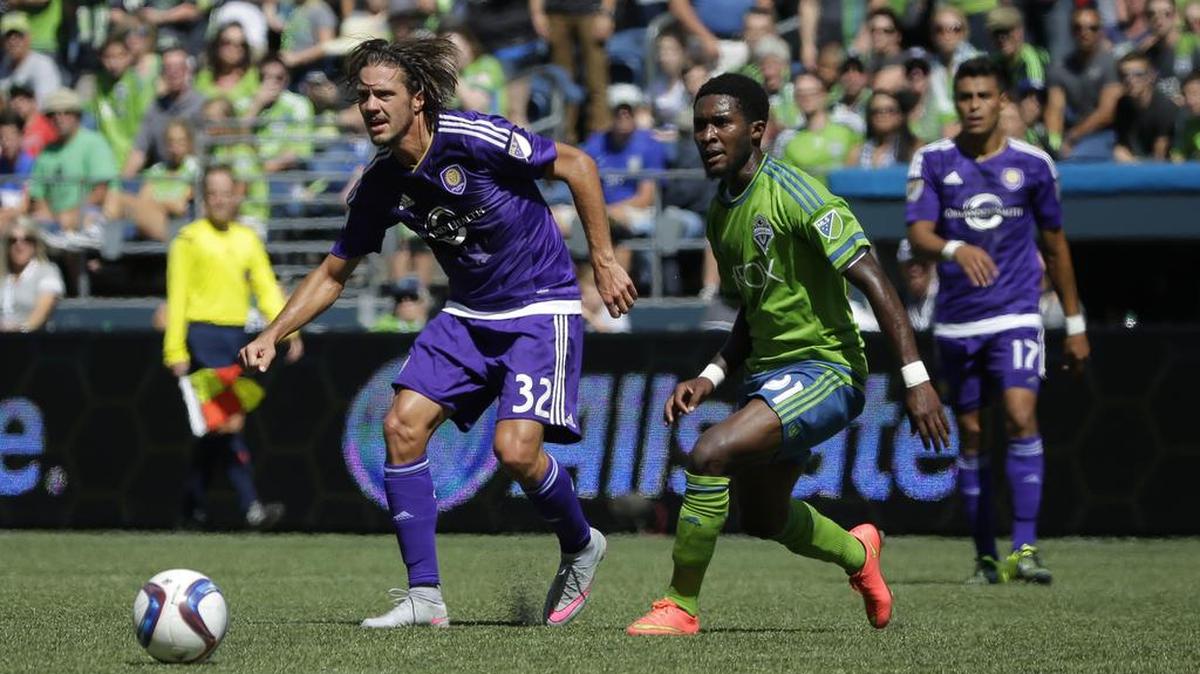 
Rookie defender Oniel Fisher, right, marking Orlando City's Adrian Winter, made his third career start for the Seattle Sounders on Sunday.
