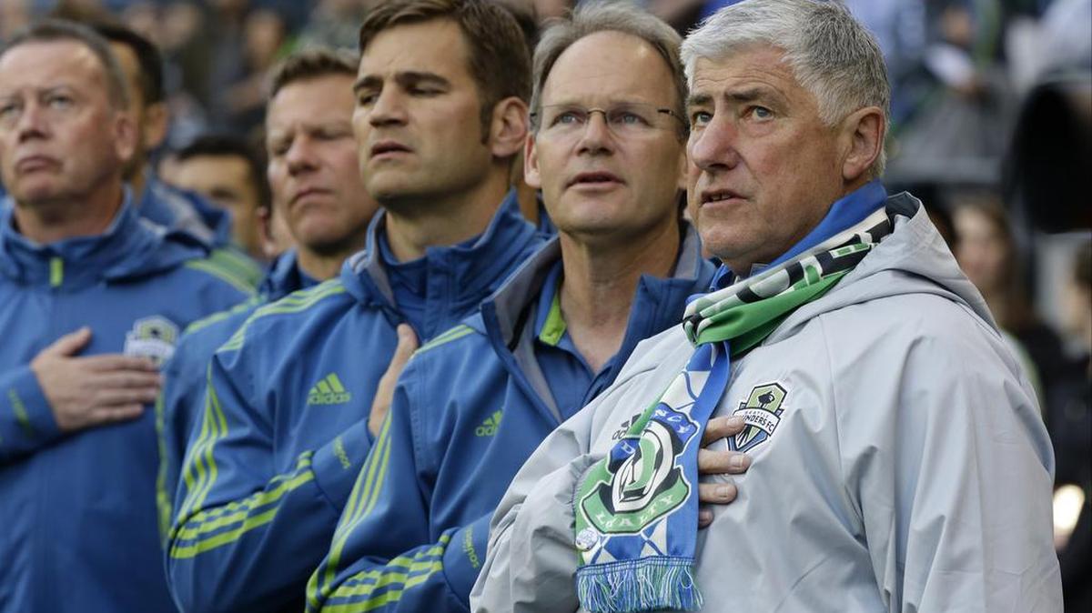 Sounders head coach Sigi Schmid, right, thinks coaching stability may be why the West has outperformed the East.