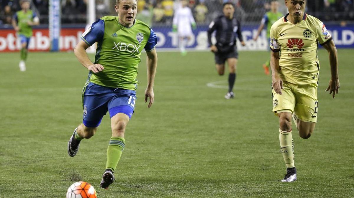 Seattle Sounders forward Jordan Morris, left, tries to outrun Club America defender Paolo Goltz, right, during the second half of a CONCACAF Champions League soccer quarterfinal Tuesday, Feb. 23, 2016, in Seattle. The match ended in a 2-2 draw.