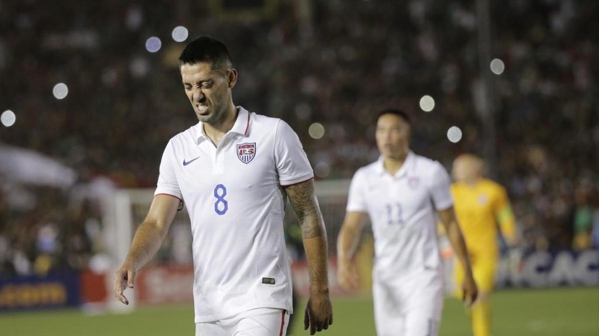 
United States’ Clint Dempsey leaves the field followed by teammate Bobby Wood after losing 2-3 against Mexico in the CONCACAF Cup soccer match Saturday at the Rose Bowl.
