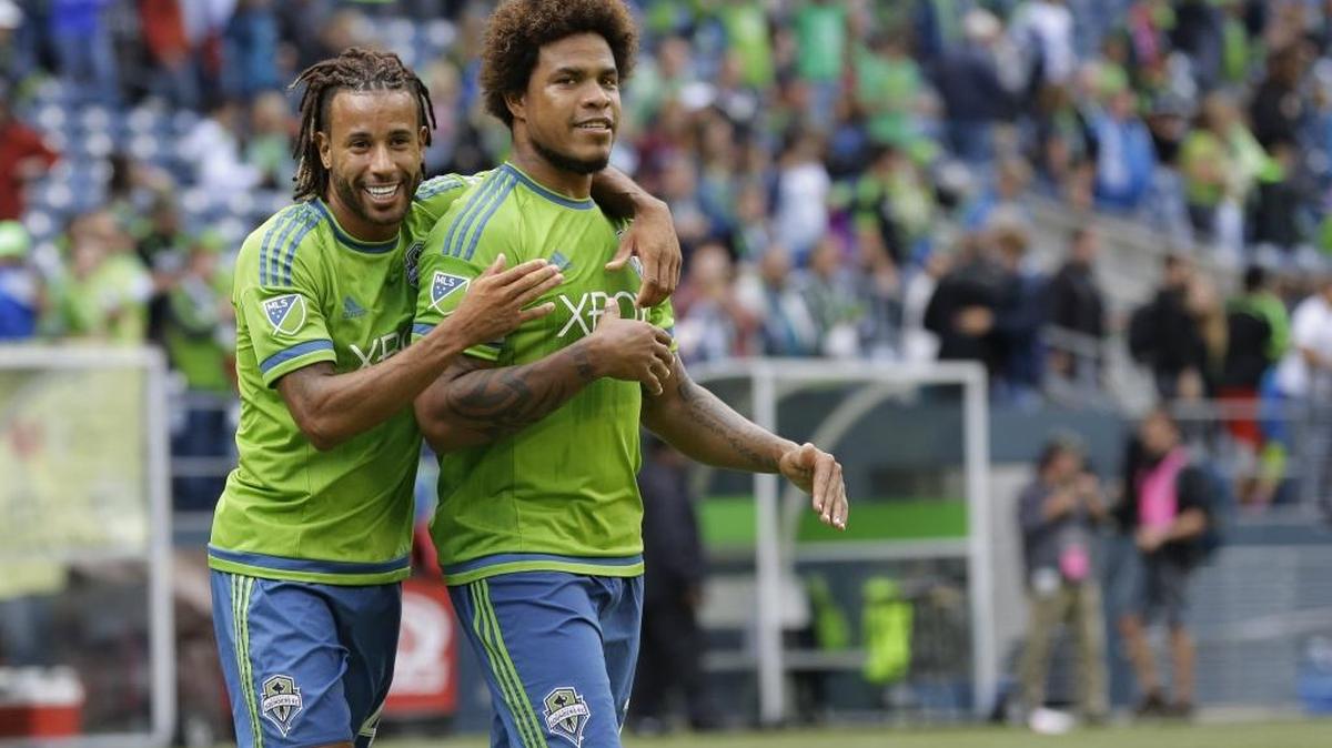 
Sounders central defender Roman Torres, right, celebrates with Tyrone Mears after they beat the Portland Timbers last month. Torres tore his anterior cruciate ligament Saturday against San Jose and will miss betwee six and nine months.
