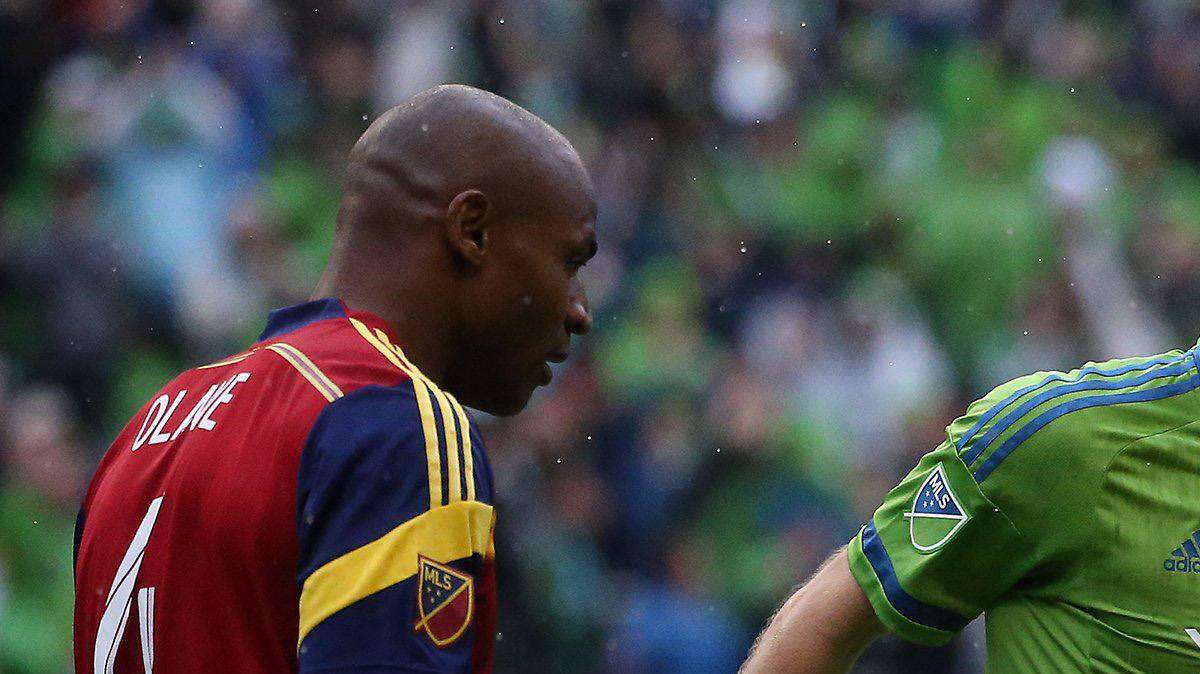 Seattle's Andreas Ivanschitz (23) hugs Clint Dempsey (2) after Dempsey scored a goal during the Sounder's regular-season finale as they play Real Salt Lake to decide if they will enter the playoffs, at CenturyLink Field, Oct. 25, 2015, in Seattle, Wash. The Sounders won, 3-1.
