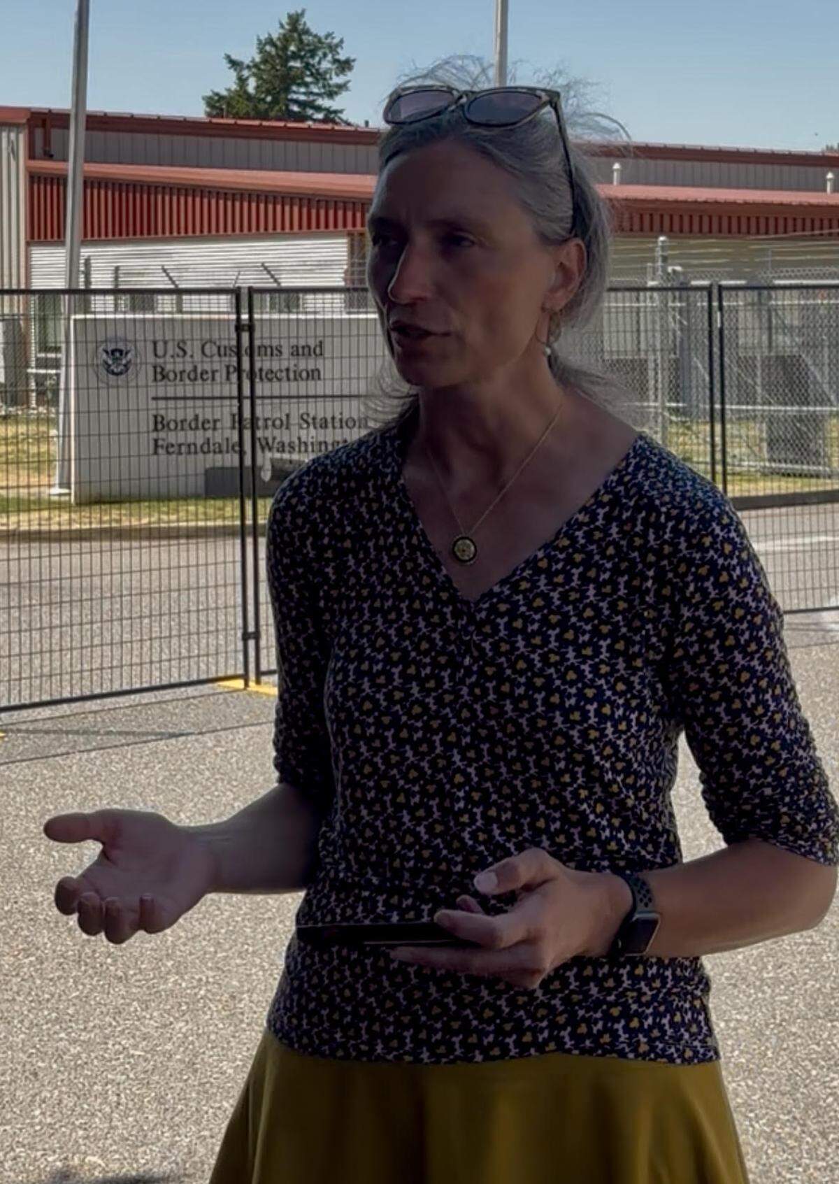 U.S. Rep. Maxine Dexter of Oregon held a press conference in front of the Customs and Border Patrol facility in Ferndale on Friday.
